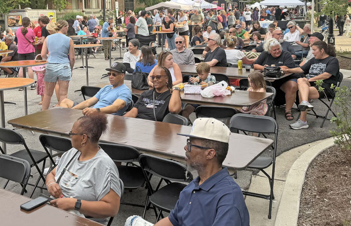 Art & Garden -Ulanowski7_web Community members watching live music at Homewood Art & Garden Fair. (Nick Ulanowski / H-F Chronicle)