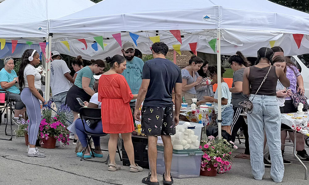 Community members explore the vendors’ booths at the Homewood Art & Garden Fair. (Nick Ulanowski / H-F Chronicle)
