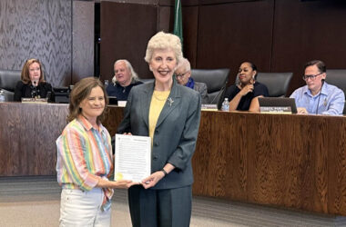 Flossmoor Mayor Michelle Nelson, left, presents a proclamation at the June 1 board meeting honoring her father, Richard Condon, on the occasion of his 95th birthday. (Jon Bannister/H-F Chronicle)
