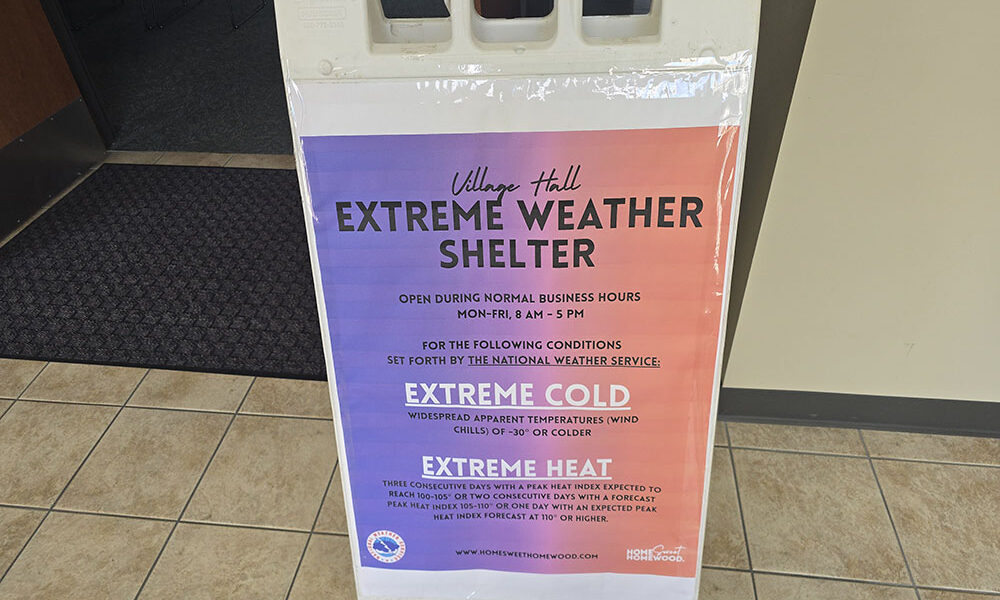 A sign in the hallway outside the Homewood village hall board room lets residents know the room can be used as a cooling shelter during days of extreme heat. (Eric Crump/H-F Chronicle)