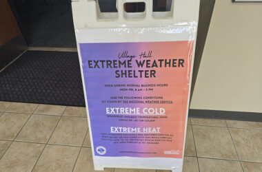 A sign in the hallway outside the Homewood village hall board room lets residents know the room can be used as a cooling shelter during days of extreme heat. (Eric Crump/H-F Chronicle)