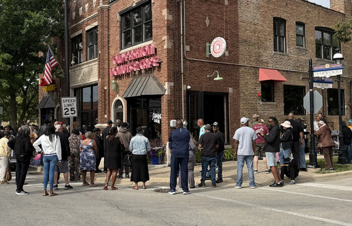 A crowd lines up around the block for the grand opening of Old Fashion Donuts & Cafe. (Nick Ulanowski / H-F Chronicle)