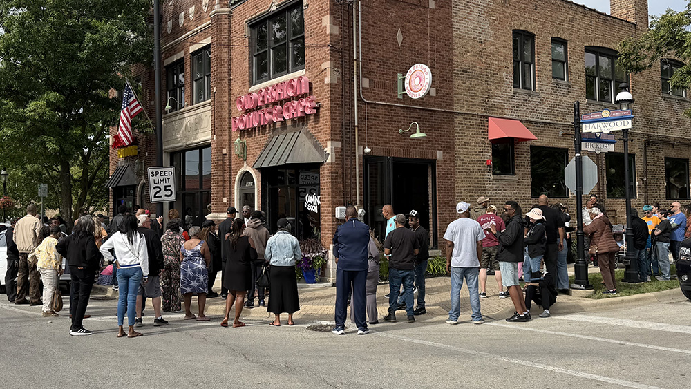 A crowd lines up around the block for the grand opening of Old Fashion Donuts & Cafe. (Nick Ulanowski / H-F Chronicle)