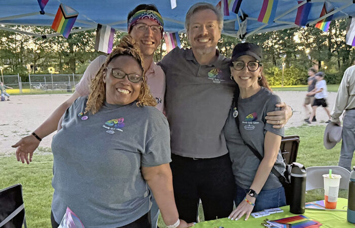 Homewood-Flossmoor Park District staffers, from left, Oralethea Davenport, Zak Kerby, Bob Birgel and Kelly Rose operate the district's booth at Pride Fest on June 12. (Nick Ulanowski / H-F Chronicle)