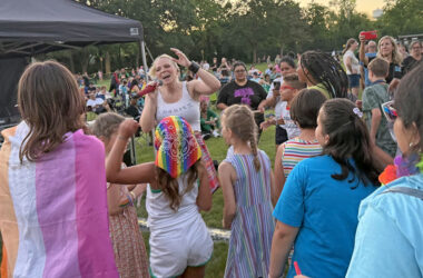 Beyond the Blonde singer Charity Marie walks through the crowd as she sings “Pink Pony Club” by Chapel Roan with attendees. (Nick Ulanowski / H-F Chronicle)