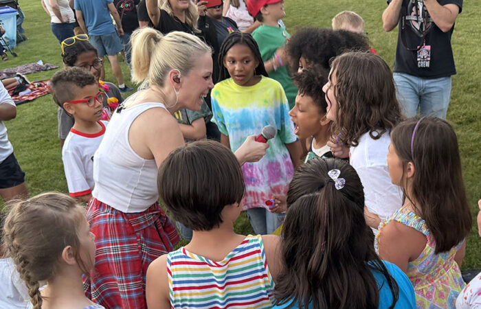 Beyond the Blonde singer Charity Marie gets help from youngsters in the audience on “Pink Pony Club” by Chapel Roan. (Nick Ulanowski / H-F Chronicle)