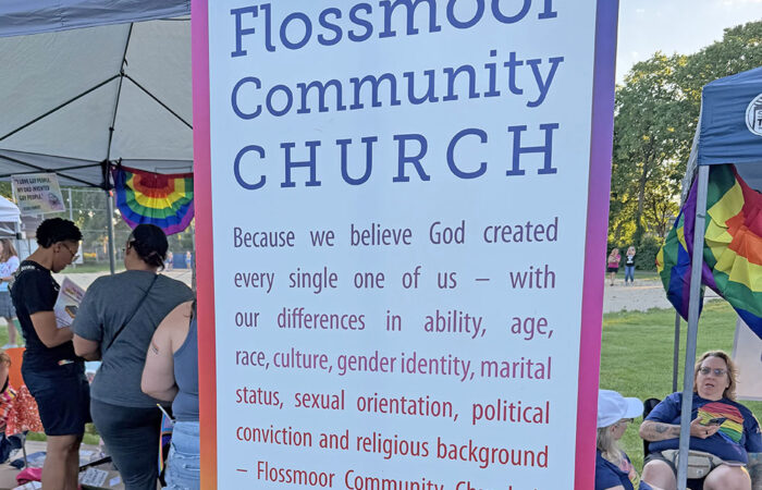 The Flossmoor Community Church booth at Pride Fest includes a statement on the congregation's values. (Nick Ulanowski / H-F Chronicle)