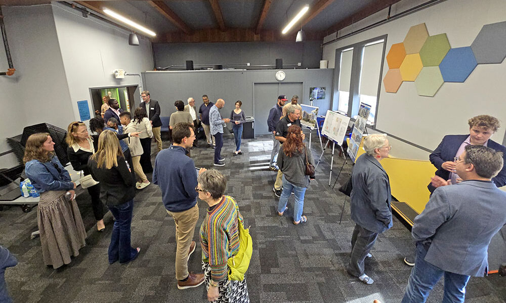 Residents, Homewood elected officials and representatives from Holladay Properties gather at the Homewood Science Center on June 16 for an open house presentation on two transit-oriented development projects in downtown Homewood. (Eric Crump/H-F Chronicle)