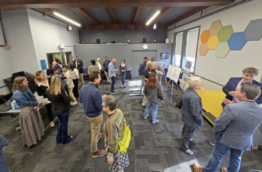 Residents, Homewood elected officials and representatives from Holladay Properties gather at the Homewood Science Center on June 16 for an open house presentation on two transit-oriented development projects in downtown Homewood. (Eric Crump/H-F Chronicle)
