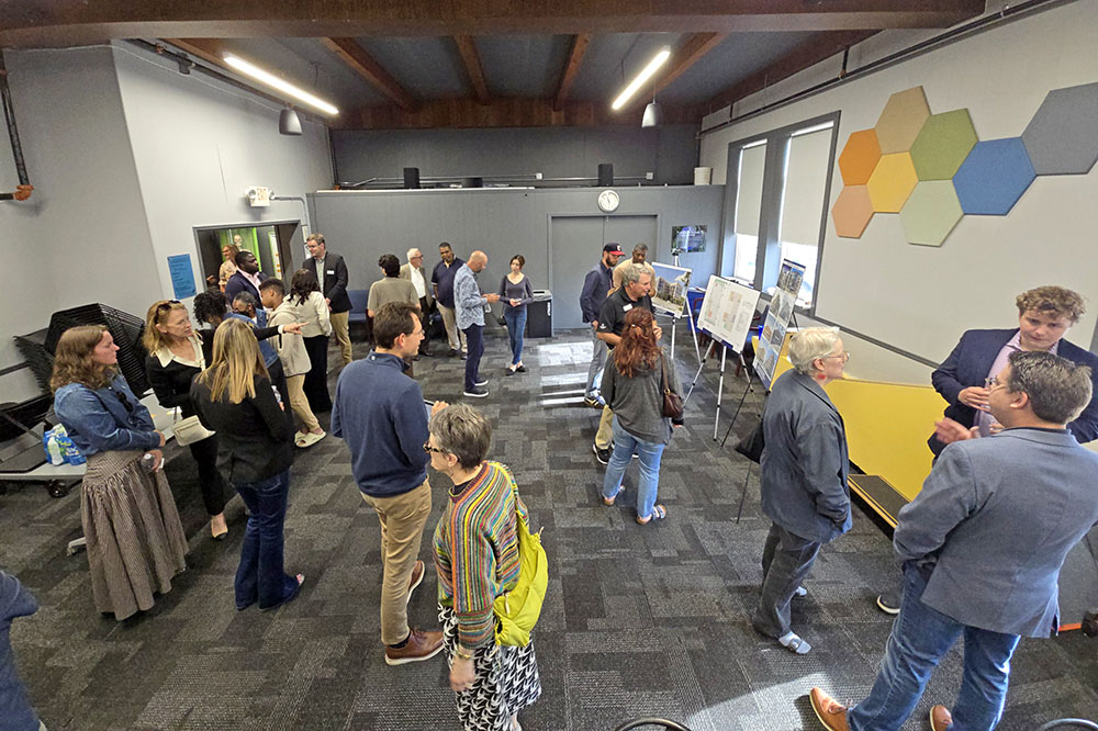 Residents, Homewood elected officials and representatives from Holladay Properties gather at the Homewood Science Center on June 16 for an open house presentation on two transit-oriented development projects in downtown Homewood. (Eric Crump/H-F Chronicle)