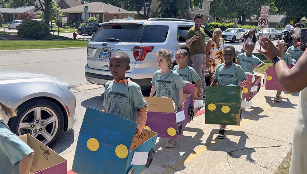Willow School students show off their hand-crafted "cars" during the annual box car parade. (Jon Bannister/H-F Chronicle)