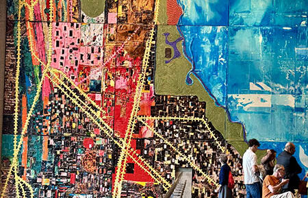 The three-story-tall “City of Big Shoulders” textured map of Chicago’s neighborhoods was created by artist Mark Bradford. It hangs on the west wall of the “Our Story Atrium” at the Obama Presidential Center. (Karen Torme Olson/H-F Chronicle)