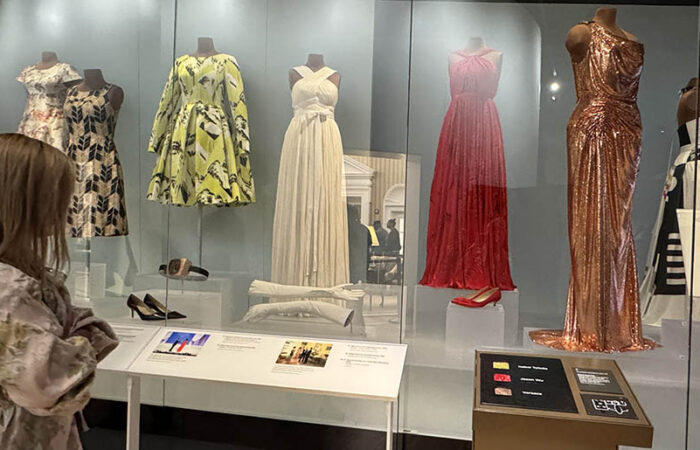 The Michelle Obama dress exhibit at the Obama Presidential Center features outfits the First Lady wore at State dinners, on election night, and at other high-profile events. The dresses are behind glass, but the exhibit also provides fabric swatches for visitors to touch. (Karen Torme Olson/H-F Chronicle)