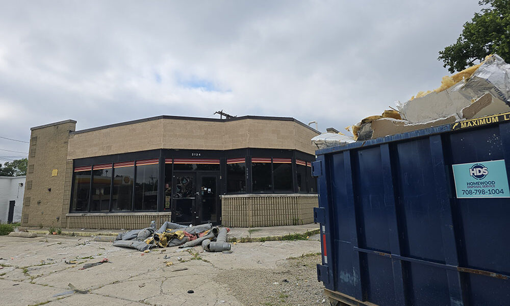 A dumpster parked at the former Citgo gas station on 183rd Street on Saturday, July 25, indicates cleanup has begun in preparation for redeveloping the building. (Eric Crump/H-F Chronicle)
