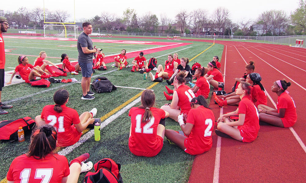 Coach Jairo Garcia speaks to the Homewood-Flossmoor girls team, for which he's an assistant coach. He's also the head boys coach and a Vikings alum. (Provided photo)