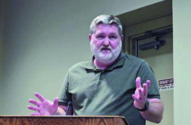 Mike Dickover speaks at the Aug. 26, 2025, Homewood board meeting to request the village increase fines for people cited for violating animal ordinances. (Eric Crump/H-F Chronicle)