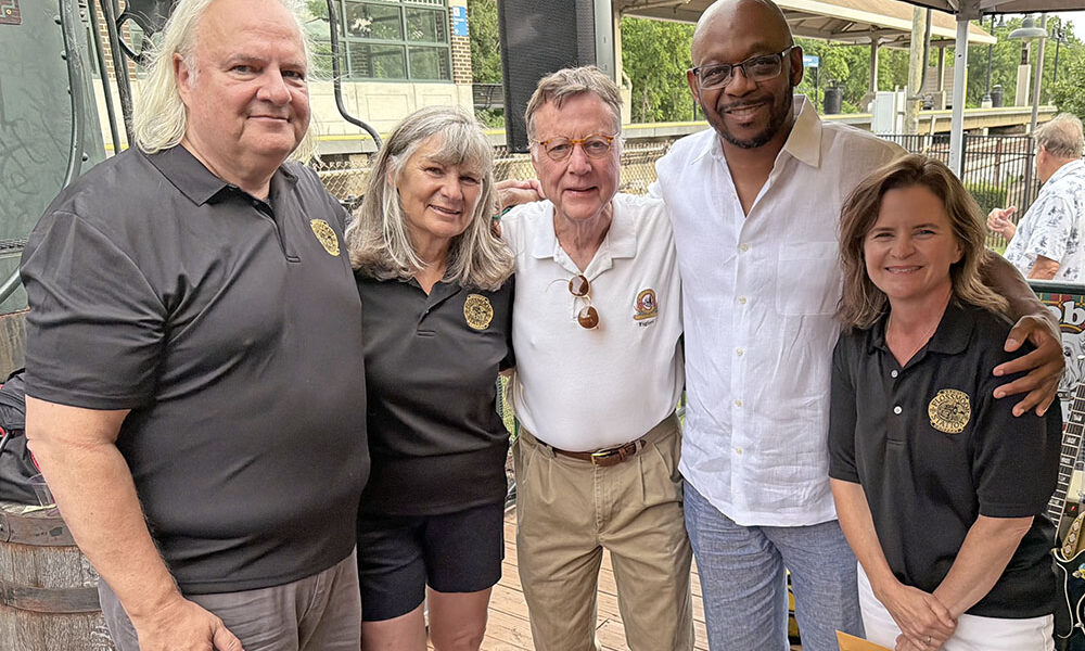 From left, Flossmoor Trustee Jim Mitros, Flossmoor Station co-owners Carolyn Armstrong and Dean Armstrong, state Rep. Will Davis and Flossmoor Mayor Michelle Nelson. (Nick Ulanowski / H-F Chronicle)
