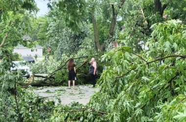 Neighbors check on each other following the storm Monday that toppled numerous trees in the area. (Eric Crump/H-F Chronicle)