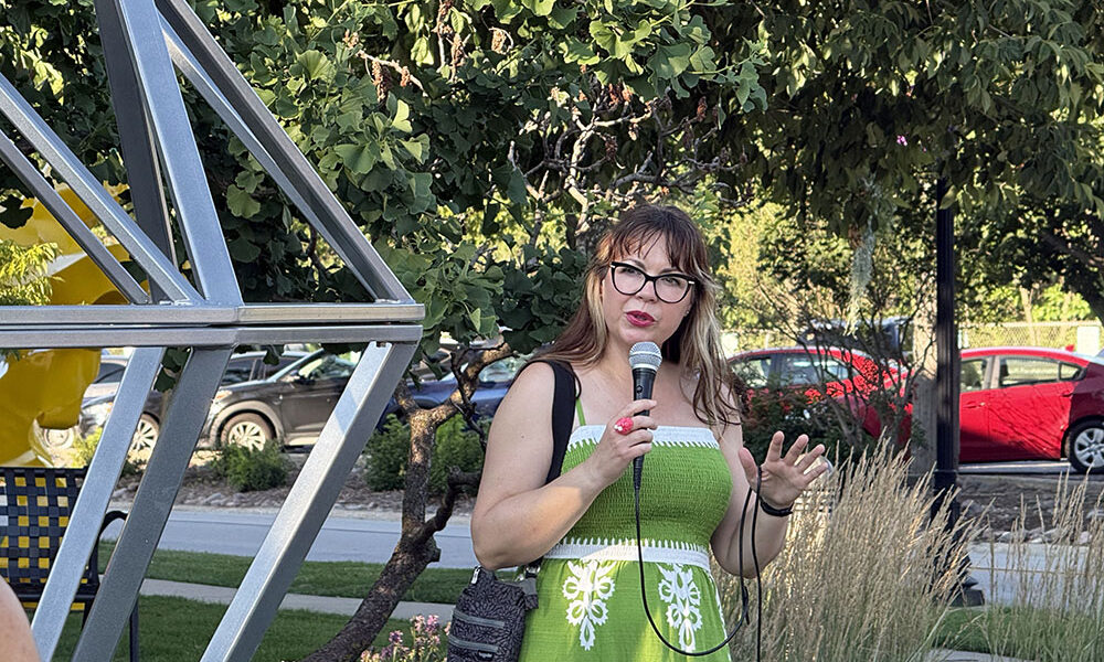 Flossmoor Art Commissioner Jodie Lawrence discusses "Centennial." “This piece was made by high school students. How special is that?" she said. (Stephanie Sokol/H-F Chronicle)