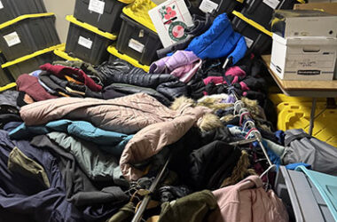 Rows of donated winter coats and storage bins were damaged when flooding filled the basement at Suburban Access Outreach. (Provided photo/Suburban Access Outreach)