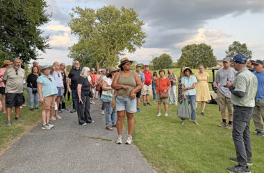 Dave Ward, in the blue cap far right, speaks to a group of people on his annual nature walk at Coyote Run Golf Course. (Stephanie Sokol/H-F Chronicle)