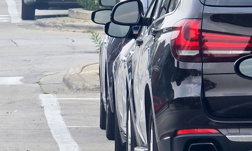Bike lanes adjacent to parking spaces are sometimes called "door zones" by cyclists who fear being struck by car doors being opened into the bike lane. The Dutch Reach is a way drivers can improve safety. (Eric Crump/H-F Chronicle)