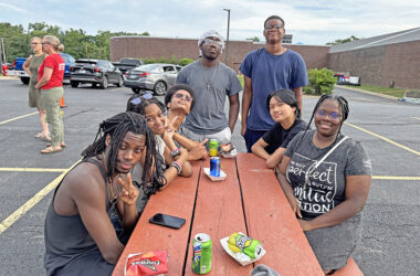 Homewood-Flossmoor High School friends, from left, Marcus Conner, Maddie Nelson, Terrance Rainey, Martin Guest, Jacari Freeman, James Yast and Lula Pollard, gathered around the picnic table. (Marilyn Thomas/H-F Chronicle)