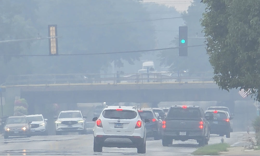 The air is hazy from wildfire smoke looking west from the intersection of Dixie Highway and 183rd Street in Homewood shortly after 2 p.m. Thursday, July 16. The smoke has drifted south from Minnesota and Canada and is expected to affect air quality in Homewood and Flossmoor through Saturday. (Eric Crump/H-F Chronicle)