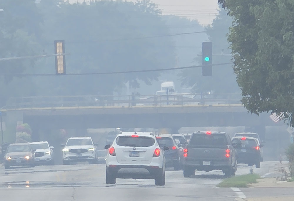 The air is hazy from wildfire smoke looking west from the intersection of Dixie Highway and 183rd Street in Homewood shortly after 2 p.m. Thursday, July 16. The smoke has drifted south from Minnesota and Canada and is expected to affect air quality in Homewood and Flossmoor through Saturday. (Eric Crump/H-F Chronicle)